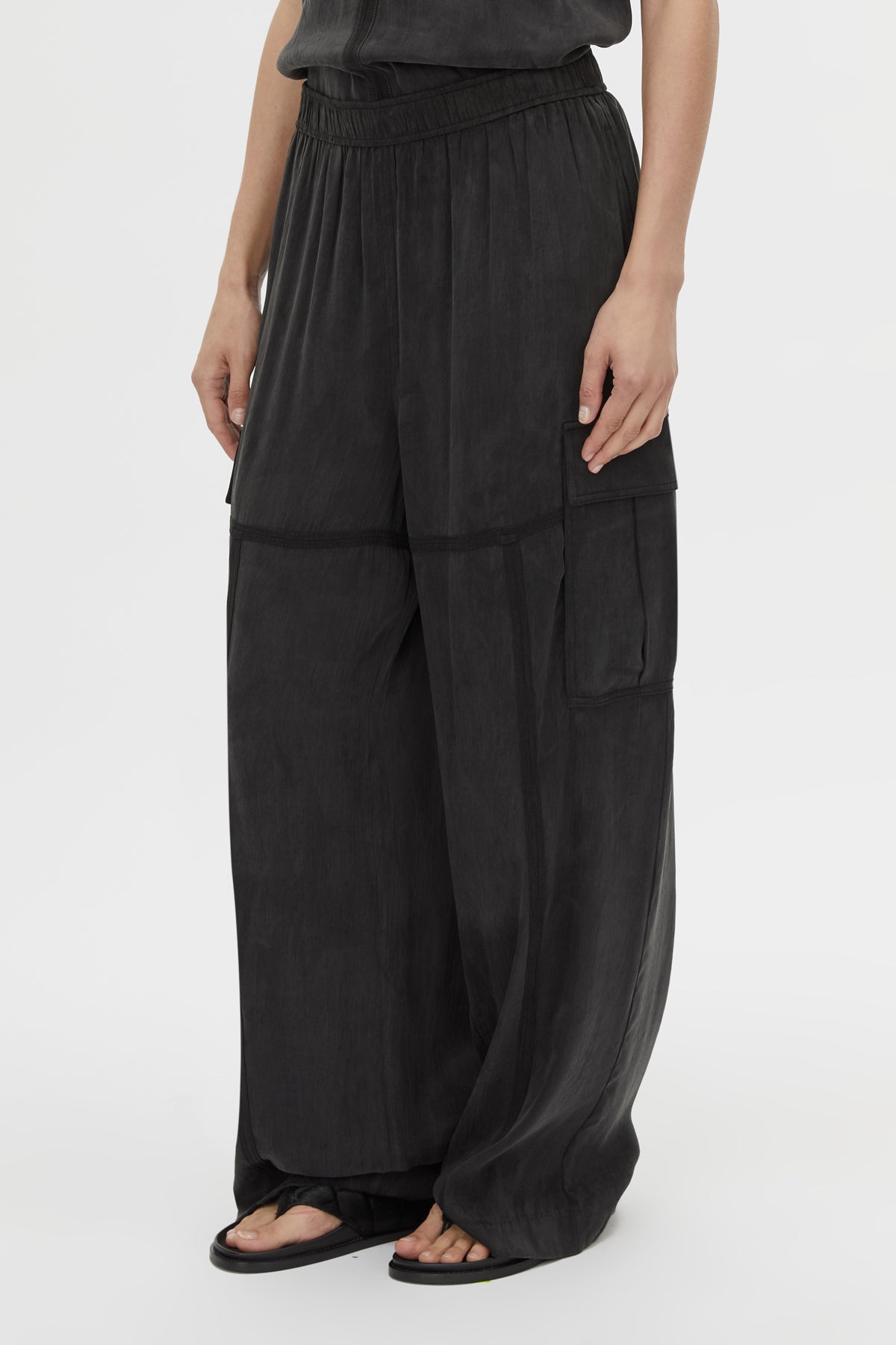 Cropped view CAMILLA AND MARC Allegro Satin Pant in Washed Black with mid‑rise cargo fit.