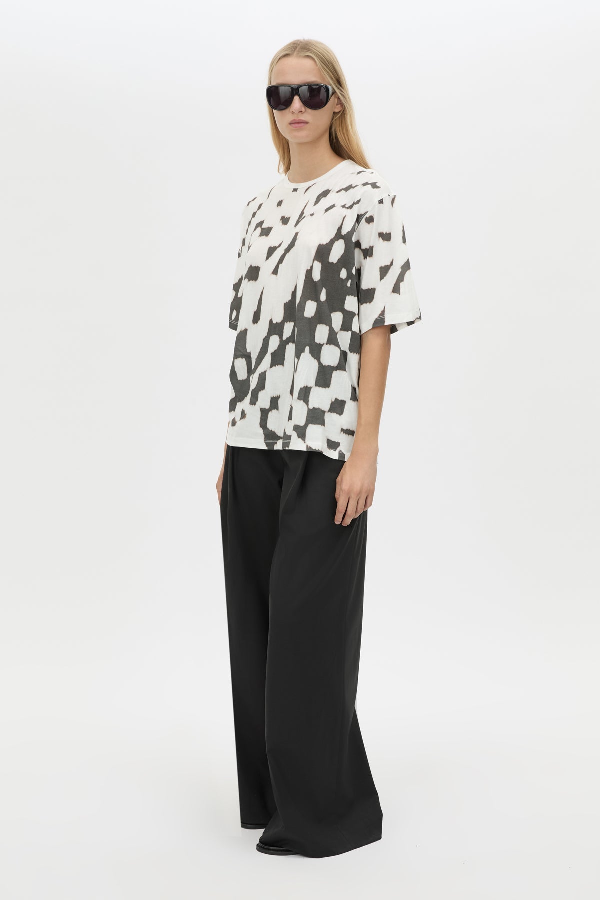 Three-quarter view CAMILLA AND MARC Asper Print Tee in Soft White with oversized short‑sleeve silhouette and printed artwork. 