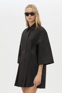 Cropped View CAMILLA AND MARC Avant collared black shirt dress with front symmetric pleat details. 