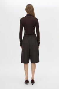 Back view CAMILLA AND MARC Barre High Neck Top in Chocolate with long sleeves and turtleneck silhouette.  