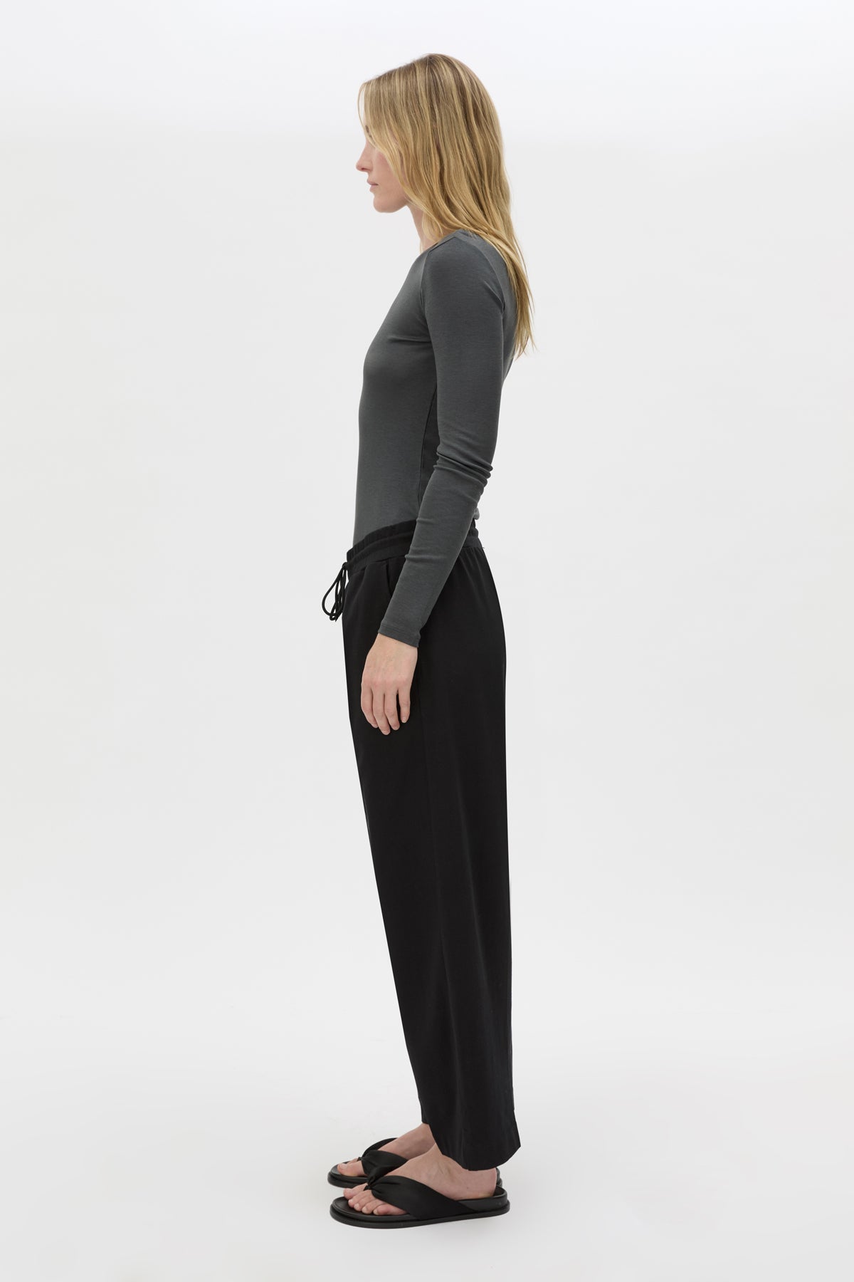 Side view CAMILLA AND MARC Beau Tapered Crop Pant in Black with elasticated waistband.