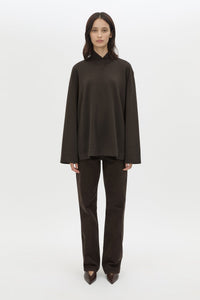 Side view CAMILLA AND MARC Bessette long sleeve top in espresso brown top with high neck. 