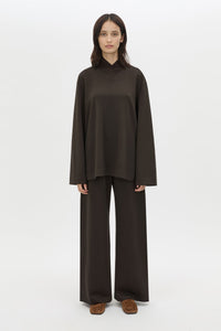 Front styled view CAMILLA AND MARC Bessette long sleeve top in espresso brown top with high neck. 