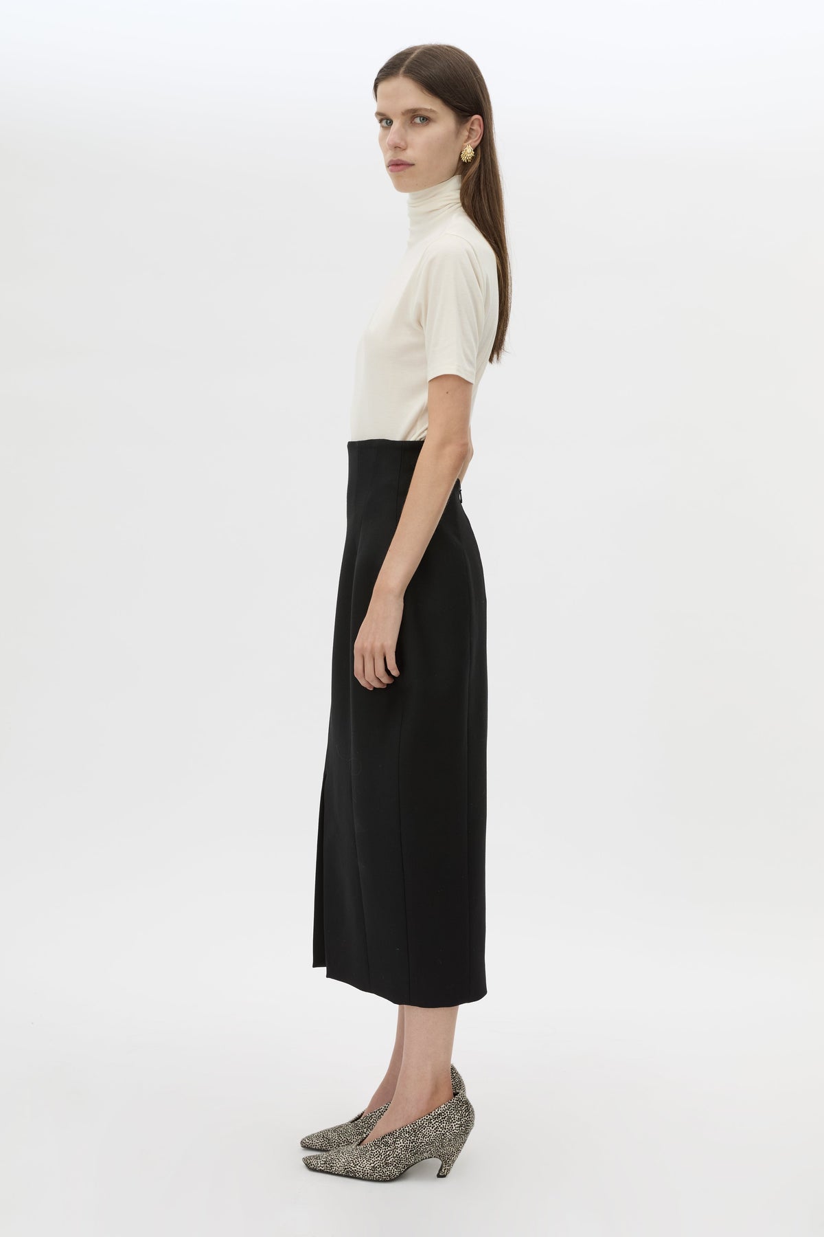 Side view CAMILLA AND MARC Caius High Corset Waist Midi Skirt in Black with structured waist.