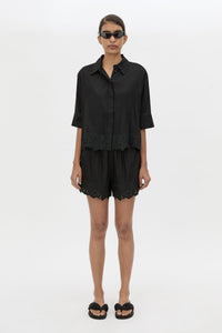 Front styled view CAMILLA AND MARC Chara Embroidered Cropped Shirt in Black with short sleeves.