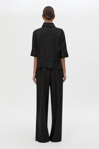 Back view CAMILLA AND MARC Chara Embroidered Relaxed Pant in Black with encased elastic waistband.