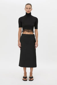 Front view CAMILLA AND MARC Chiaro Midi Skirt in black with low‑rise fit.