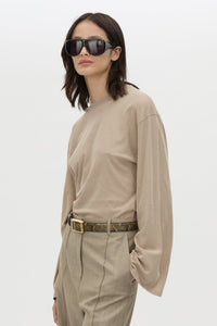 Cropped view CAMILLA AND MARC Dakota long sleeve relaxed top in taupe with crew neckline and semi sheer fabrication.