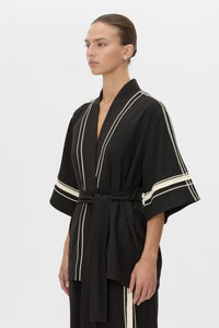 Cropped view CAMILLA AND MARC relaxed Enna Robe in black with embroidery detail.