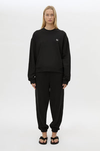 Front styled view CAMILLA AND MARC Lyra Embroidered Tracksuit Top in Black and White with relaxed fit.