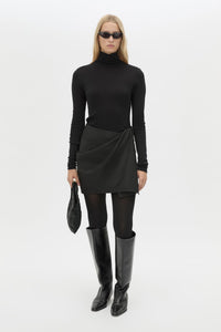 Front view CAMILLA AND MARC Mackinley Mini Wrap Skirt in Black with a draped low‑rise silhouette.