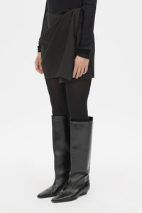 Cropped view CAMILLA AND MARC Mackinley Mini Wrap Skirt in Black with a draped low‑rise silhouette.