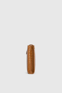 Side view CAMILLA AND MARC Mette Croc Clutch in tan croc‑embossed leather.