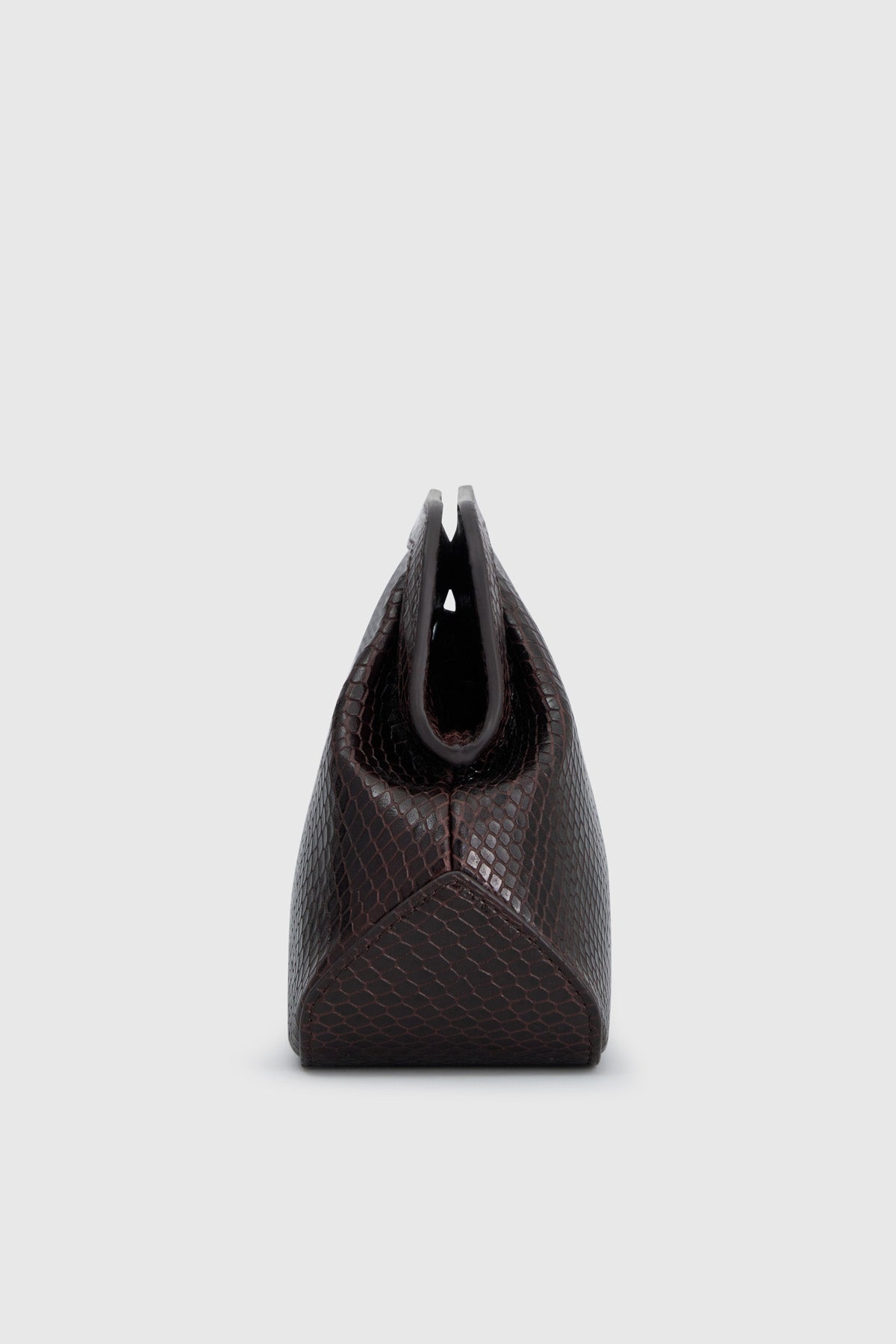 Side view CAMILLA AND MARC Mette Mini Snake Bag in chocolate snake‑textured leather.