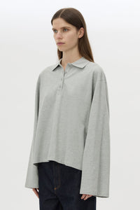 Cropped view CAMILLA AND MARC Moreno Long Sleeve Polo Top in Grey Marle with quarter button placket, rib collar and embroidered monogram.
