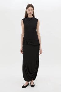 Front-styled view CAMILLA AND MARC Myro Midi Dress in black with a fitted waistline and a twisted drape detail at the hip.