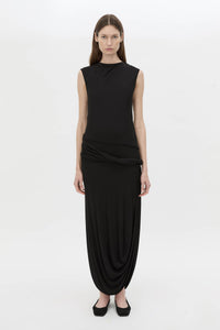 Front view CAMILLA AND MARC Myro Midi Dress in black with a fitted waistline and a twisted drape detail at the hip.