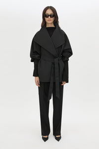 Front styled view CAMILLA AND MARC Nasir Cropped Jacket in Black with high‑neck, double‑breasted wrap design.