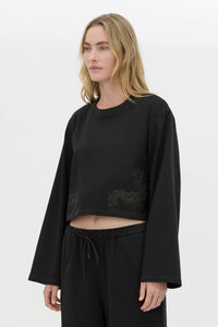 Cropped view CAMILLA AND MARC Niami Crochet Cropped Top in black with cut‑away crochet detailing at hem.