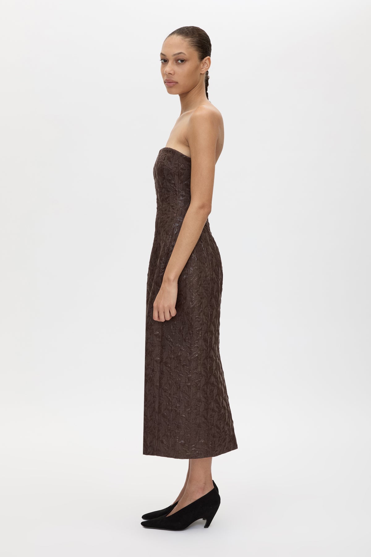 Side view CAMILLA AND MARC Rennick Strapless Midi Dress in chocolate brown with fitted internal bodice and exaggerated hip.