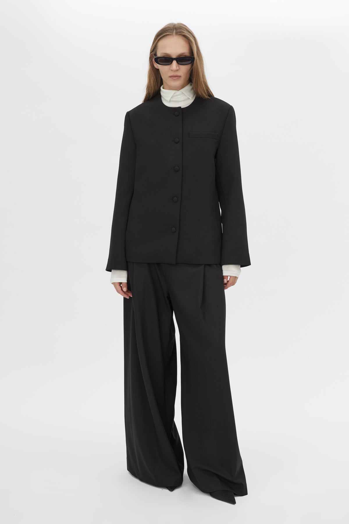Front View CAMILLA AND MARC San fitted collarless blazer in black with Front button closure.
