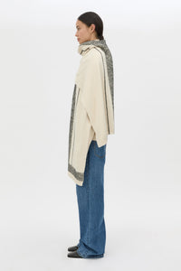 Side view CAMILLA AND MARC Tusk Knit Stripe Scarf in Black with striped jacquard graphic and Australian wool fabrication.
