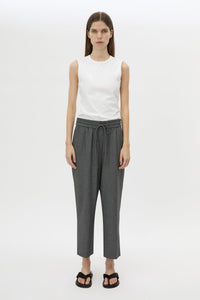 Front styled view CAMILLA AND MARC Vector Crop Pant in Charcoal Grey with soft suiting fabrication.