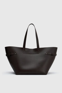 Back view CAMILLA AND MARC Willa Tote in Chocolate Brown with side strap and buckle detailing and magnetic button closure.