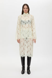 Front styled view CAMILLA AND MARC Zemira Long Sleeve Lace Top in Cream with sheer lace and high neckband.