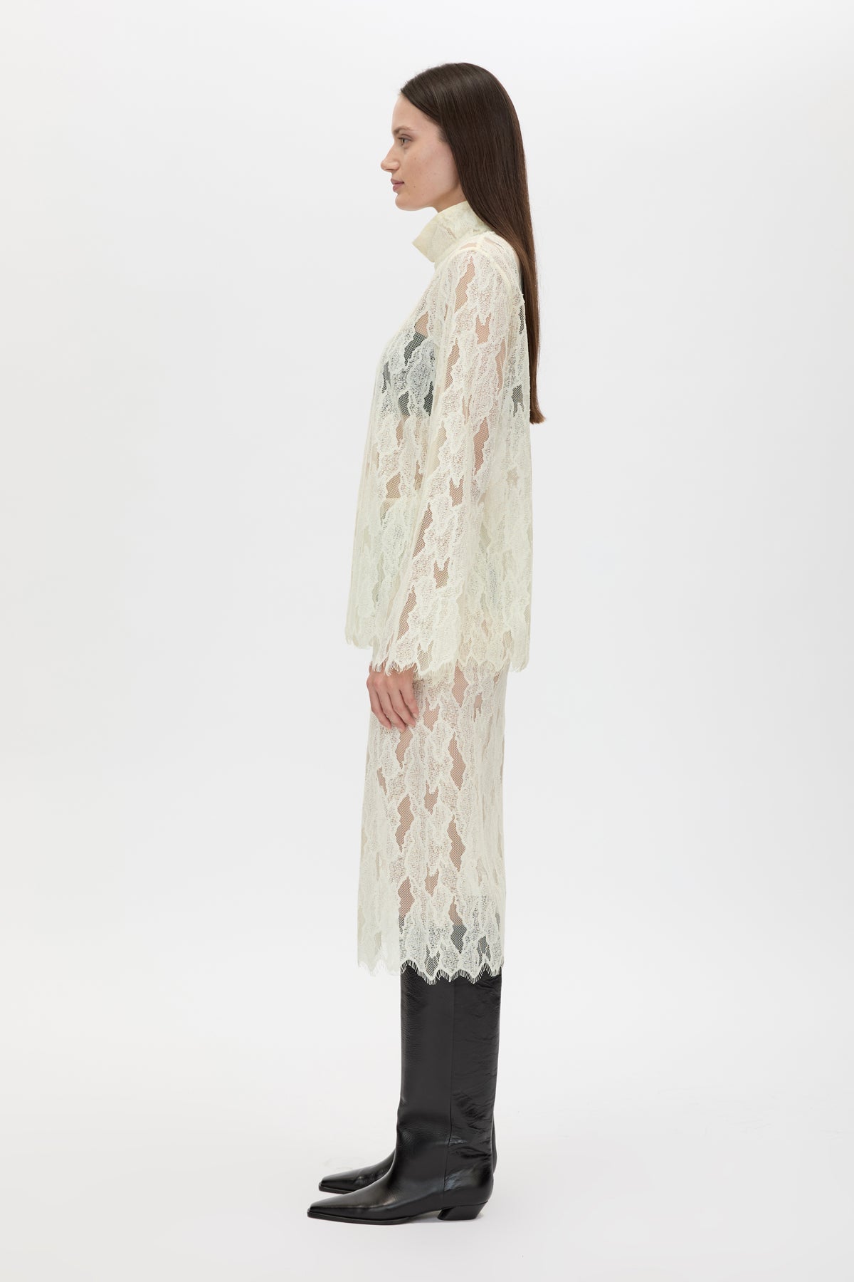 Side view CAMILLA AND MARC Zemira Long Sleeve Lace Top in Cream with sheer lace and high neckband.