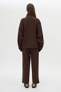 Back view CAMILLA AND MARC Zylus funnel neck pullover sweater in chocolate/white with contrast embroidered monogram.